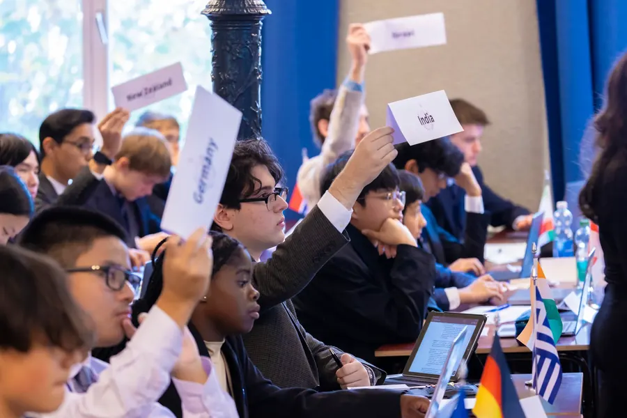 Students raising placards at a Model UN session